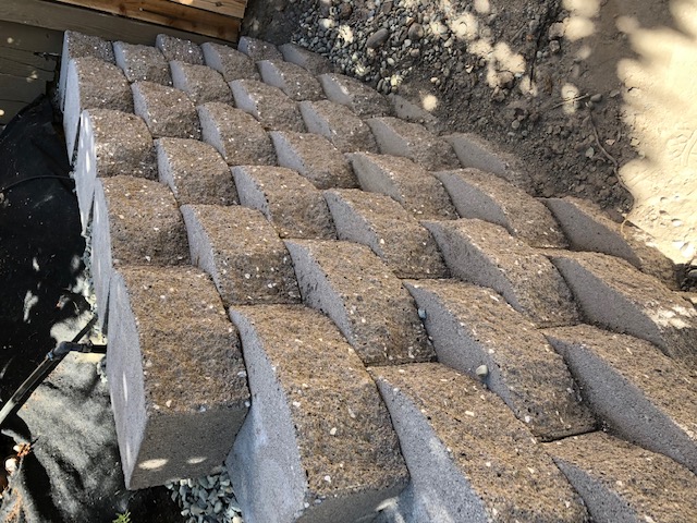 Custom brick masonry steps with bullnose edging matching a natural clay paver landing