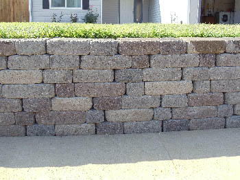 Custom brick masonry steps with bullnose edging matching a natural clay paver landing