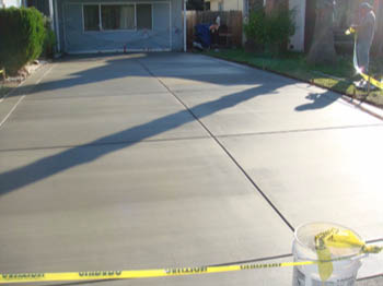 Reinforced concrete driveway installation with stamped border in Sacramento, CA.