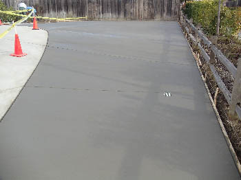 Reinforced concrete driveway installation with stamped border in Sacramento, CA.