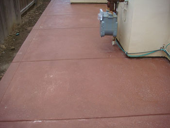 Close up of a slip resistant salt rock finish concrete pool deck in Elk Grove, CA