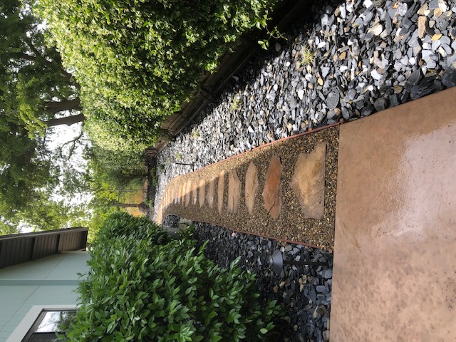 Curved stamped concrete walkway with charcoal border in Elk Grove, CA
